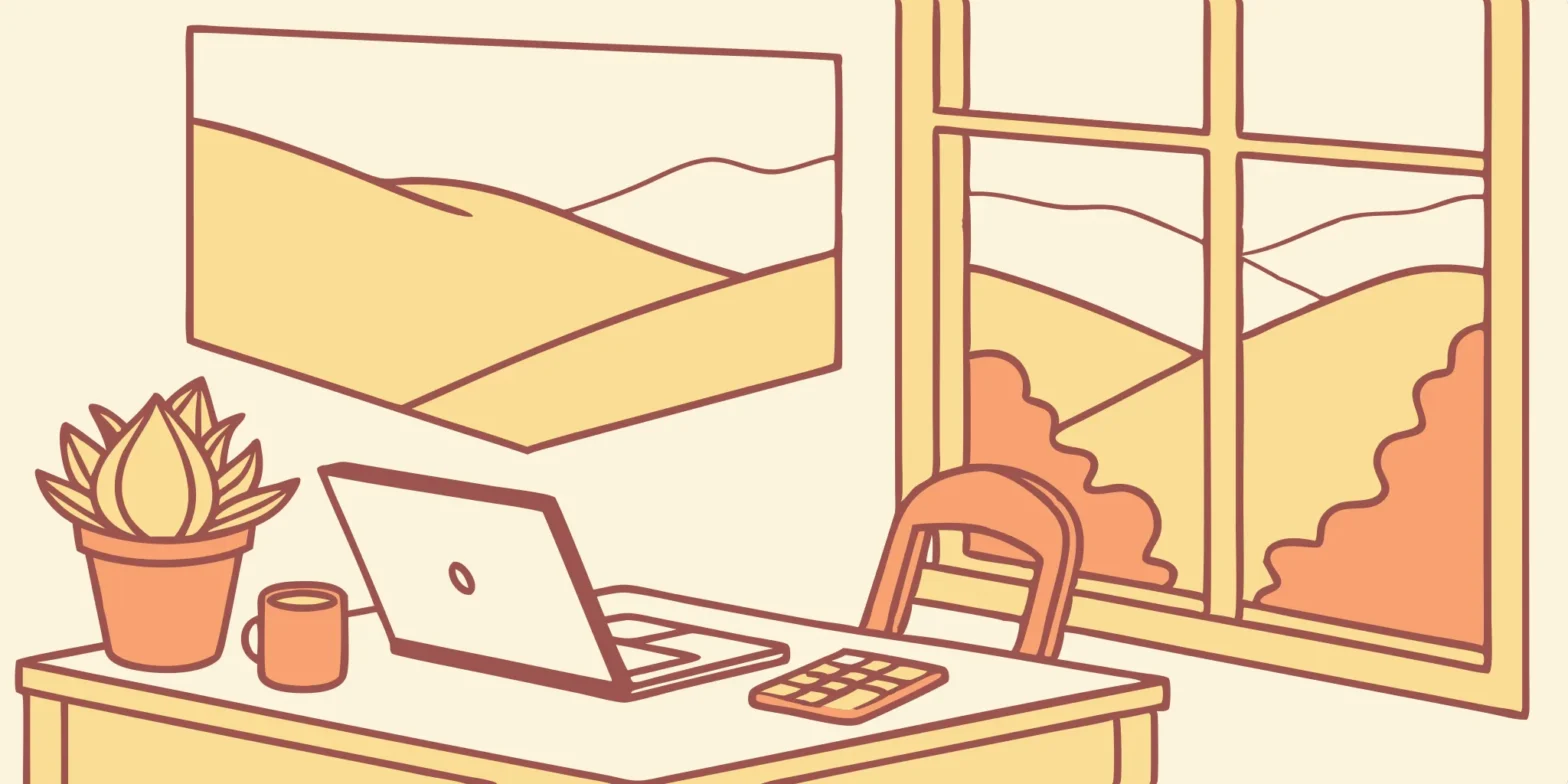 Laptop, plant, and window in a cozy office setting.