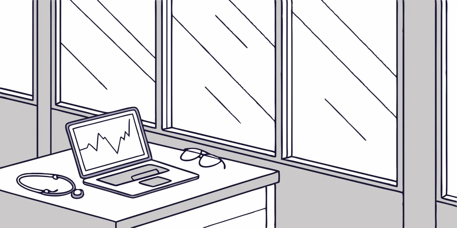 Stethoscope, glasses, and laptop displaying financial chart. Medical practice tax deductions.
