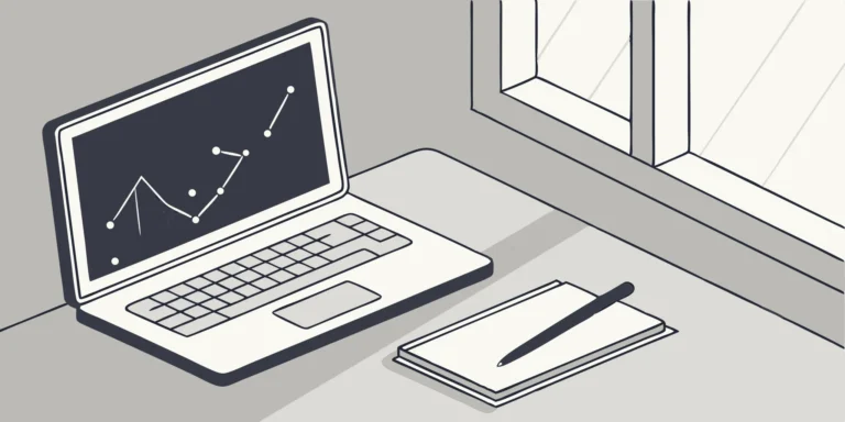 Startup accounting software setup on laptop with notebook and pen.