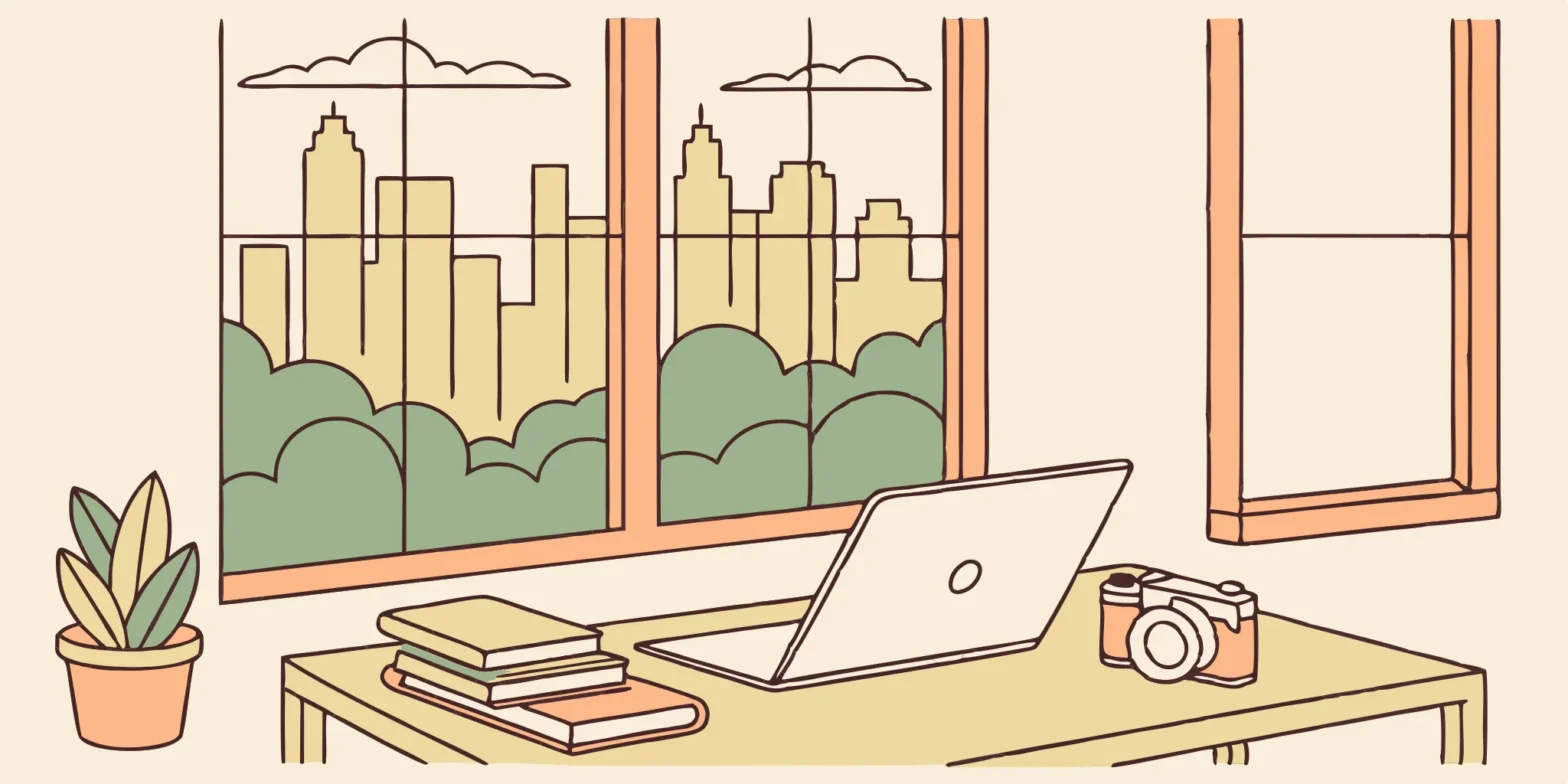 Camera, laptop, and books on desk by Austin window. Photographer's tax planning workspace.