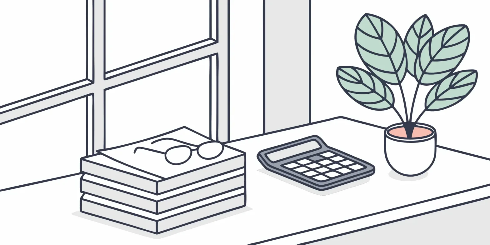 Small business tax audit representation: Documents, calculator, and eyeglasses on a desk.