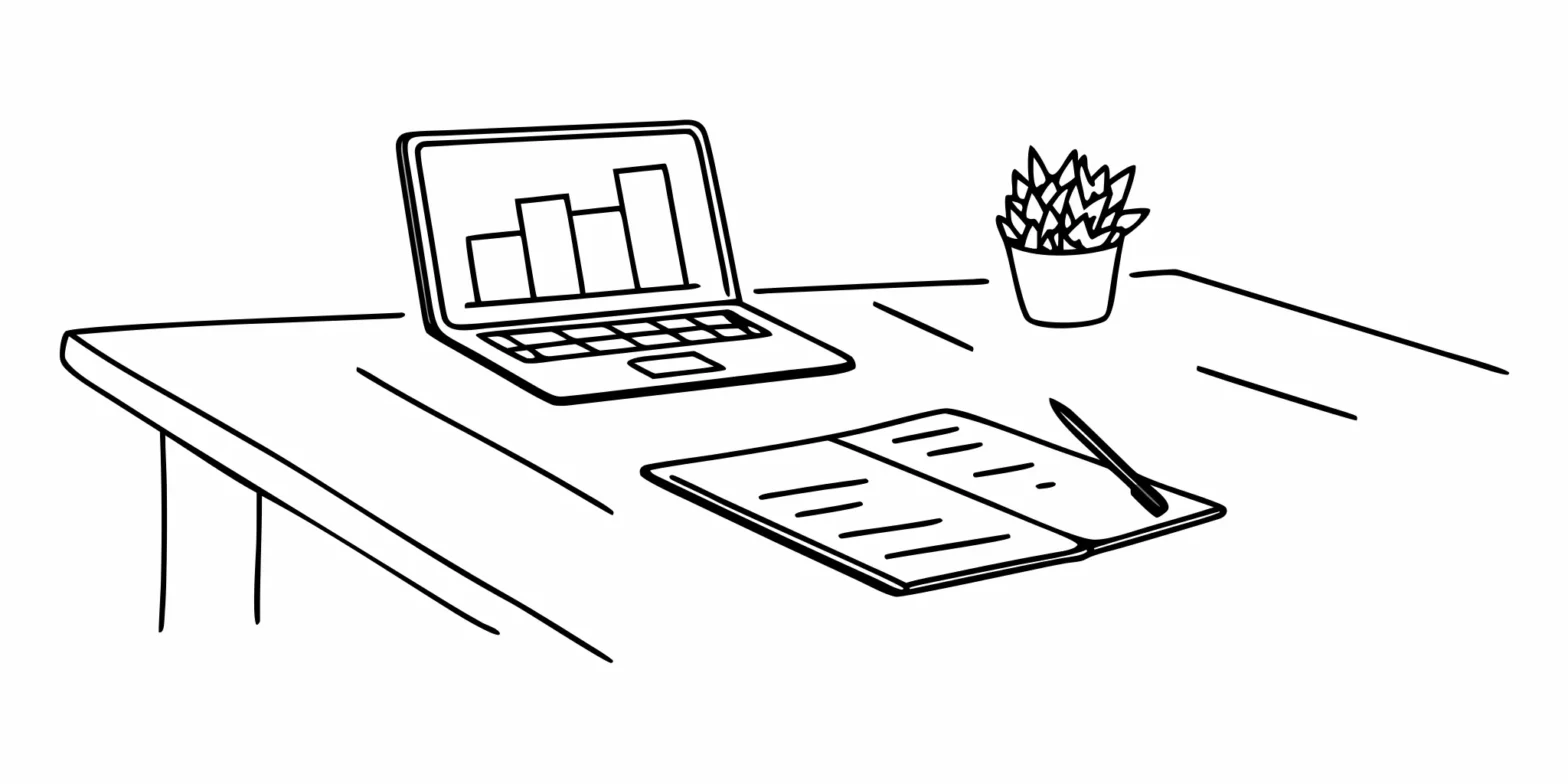 Laptop and notebook on a desk for managing a new business's accounting and payroll services.