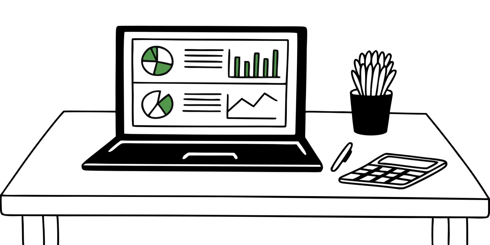 Laptop on a desk showing a QuickBooks dashboard for small business accounting.