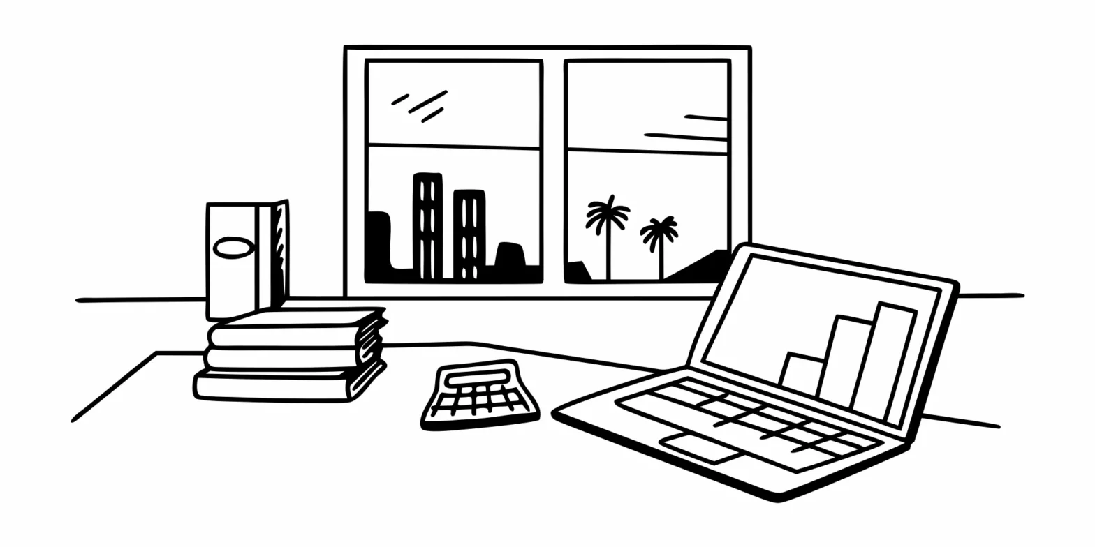 Laptop with charts and a calculator used for developing company tax planning strategies.