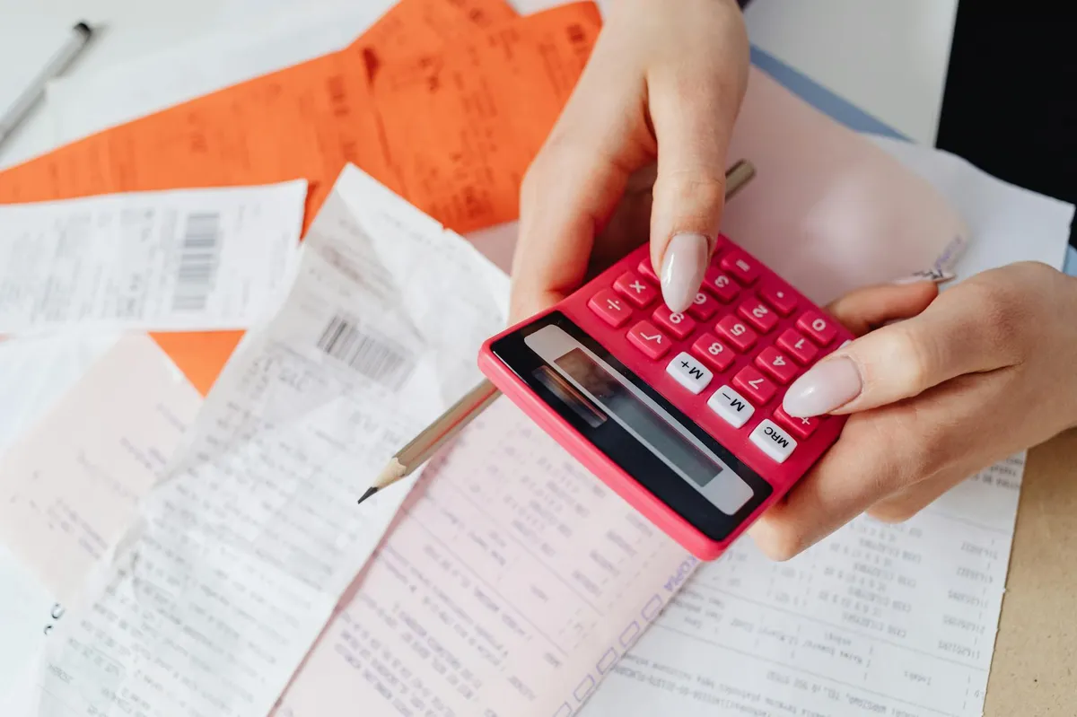 Home office setup for consultant tax deductions with calculator and organized receipts